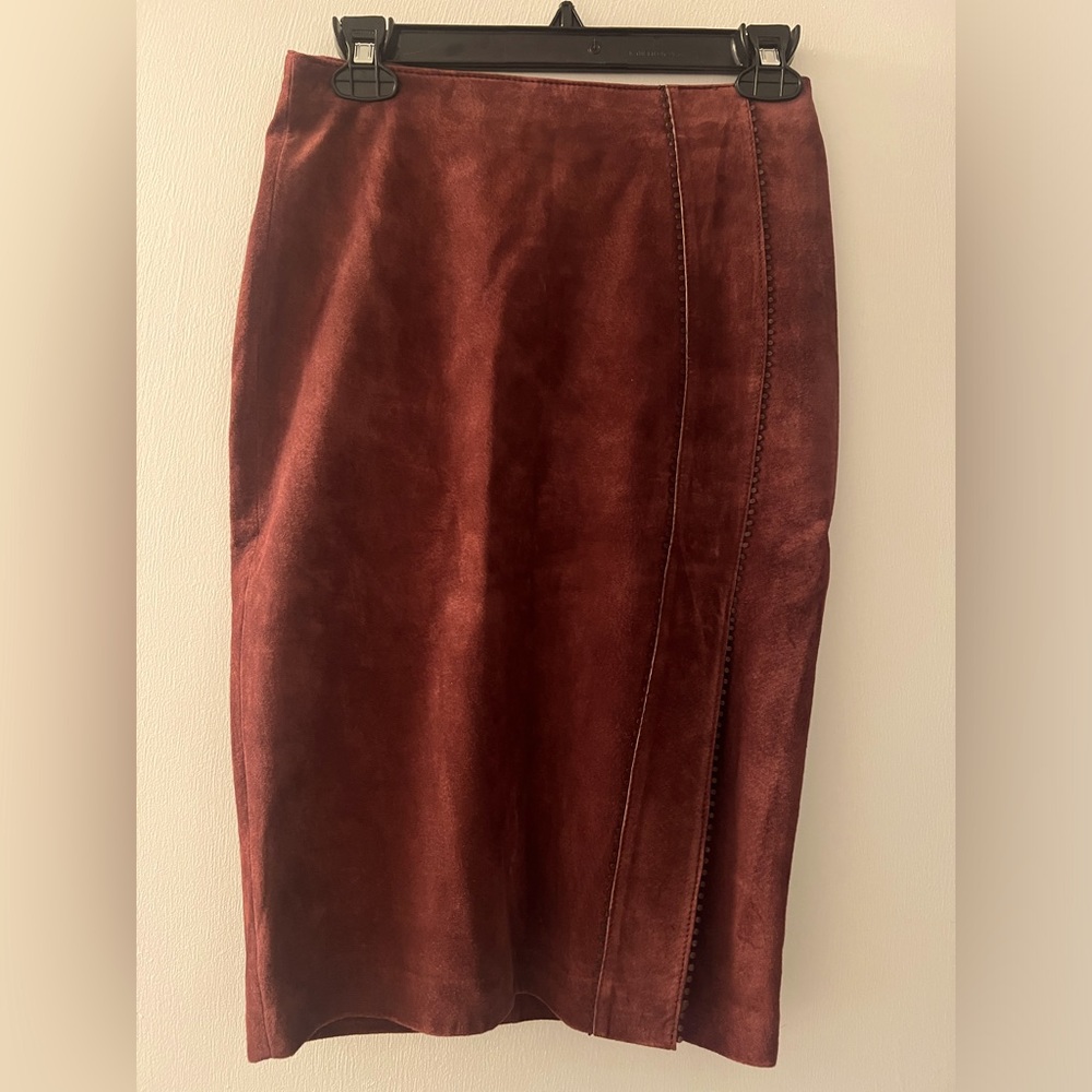 Danier suede burgundy pencil skirt with slit on one side.